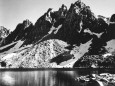 "Kearsarge Pinnacles," Partially Snow-Covered Rocky Formations Along the Edge of the River