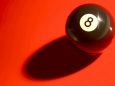 Eight Ball on with Shadow on Red Billard Table